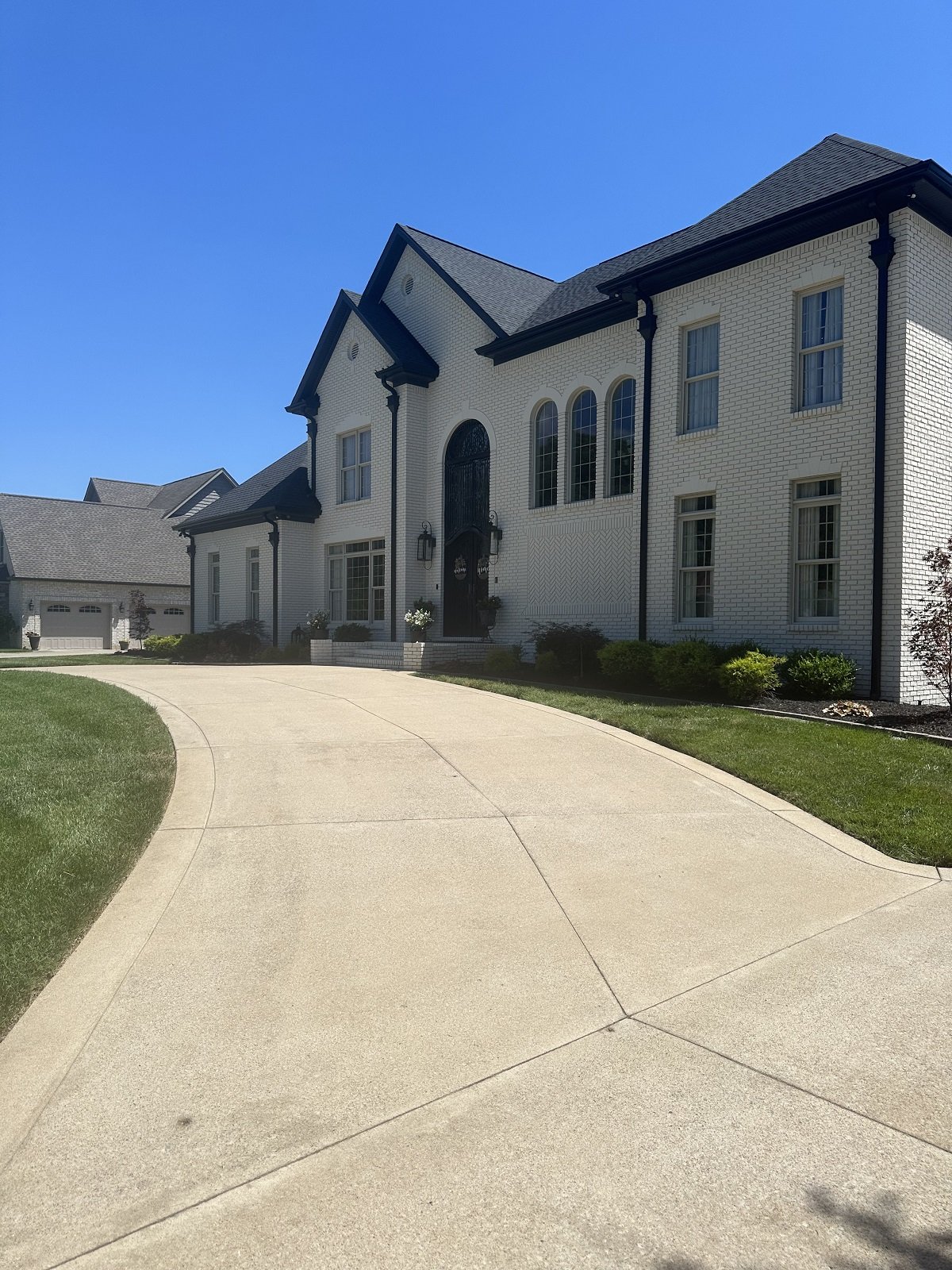Licensed power washing professional from Falcons Pressure and Soft Washing cleaning residential siding